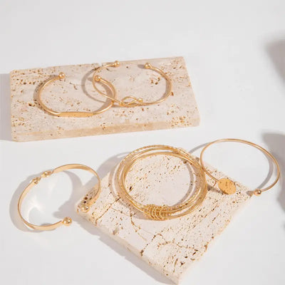Elegante Knotete Armband Set in Gold